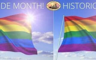 lgbtq pride flags with a sunny sky background.