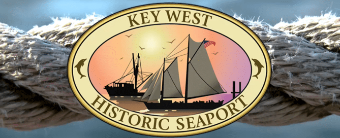 key west historic seaport logo with rope around it and a blueish background.
