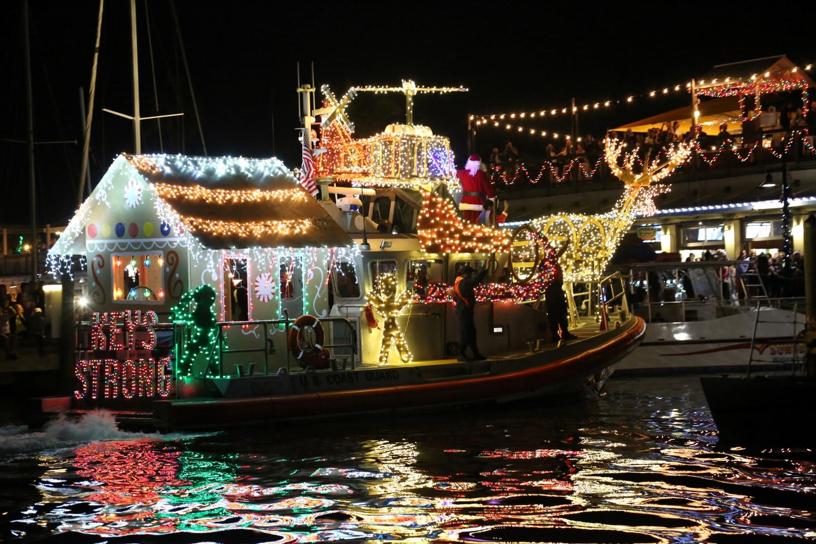 key west historic seaport lighted boat parade lighted boats on the water.