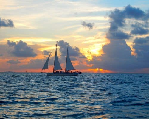 key west sailboat with sunset in background