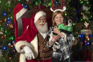 santa and girl with pet
